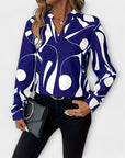 Elegant long-sleeved blouse with a pointed neckline