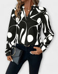 Elegant long-sleeved blouse with a pointed neckline